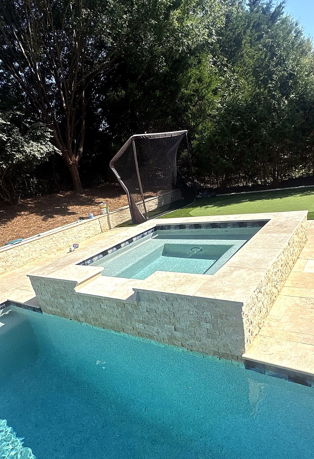 Pool bubblers and sheer descent water feature